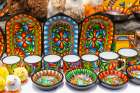 Colorful dishes, and stuffed ducks were on sale on the walls of the Basilica of Quito. Art Print